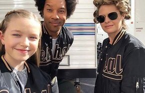 Celebrities In matching black And gold custom jackets