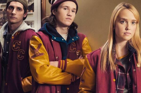 Maroon and gold outerwear with Hockey crossed sticks Logo student group