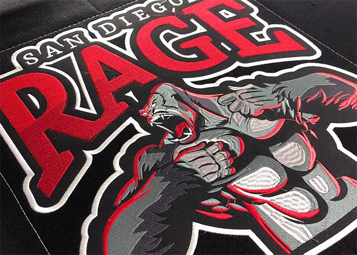 Detailed close-up of custom embroidery with viscose thread on Clothoo varsity jacket