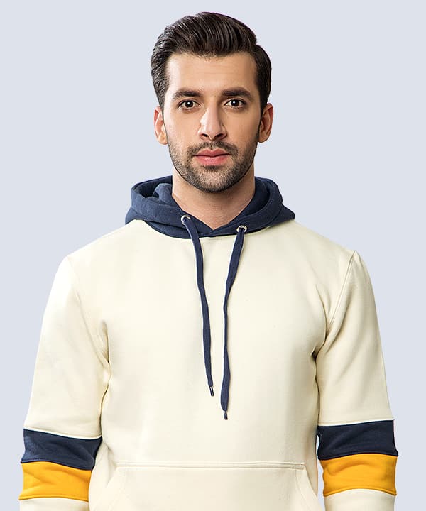 Cream hoodie with navy hood and gold cuffs