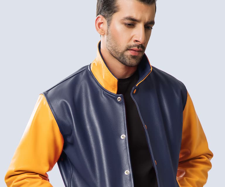  Navy cowhide leather body with white leather sleeves and shirt collar. 