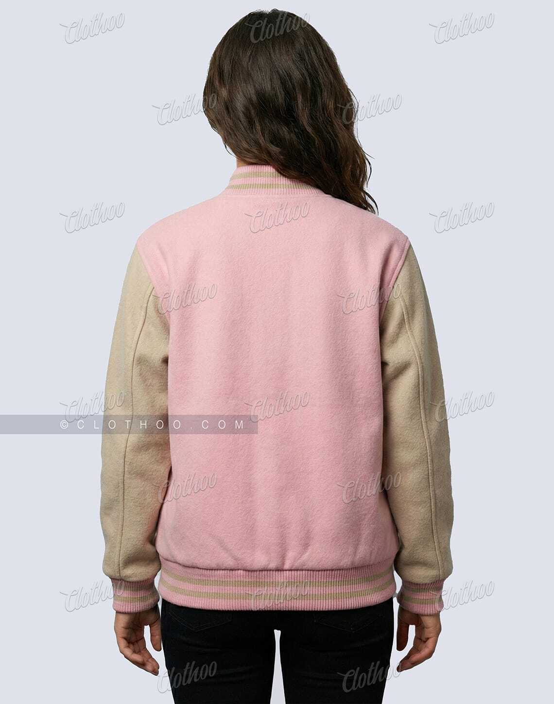 Back view of women’s baby pink and beige wool varsity jacket showing color block sleeves