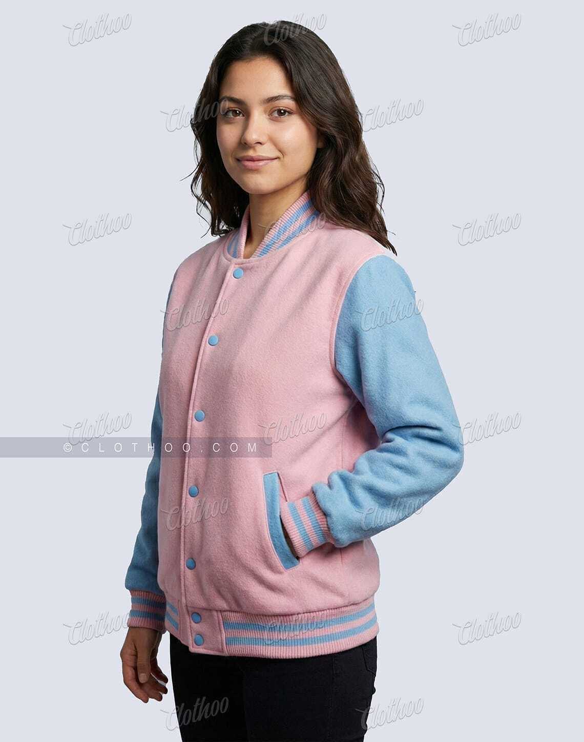 Side view of women’s baby pink and sky blue wool varsity jacket with striped pink and blue rib knit cuffs